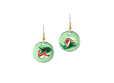 Green round earrings with a red and white design on a white background
