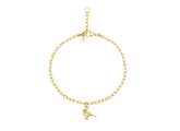 Gold bracelet with a small bird charm on a white background