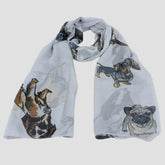 A light grey chiffon scarf with various dog breeds printed on it.