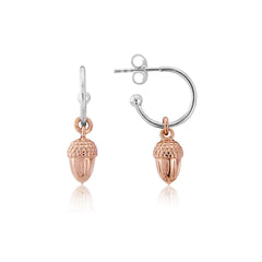 A pair of rose gold acorn hoop earrings with sterling silver and 14ct rose gold vermeil. The earrings feature a small acorn charm attached to the hoop.