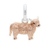 A rose gold-colored sterling silver Highland Cow charm.