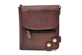 A security purse in soft brown Irish leather with a zipper closure, belt loop, and a leather cord.