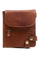 A security purse in soft tan Irish leather with a zipper closure and a Velcro flap, designed to be worn on a belt or across the body.