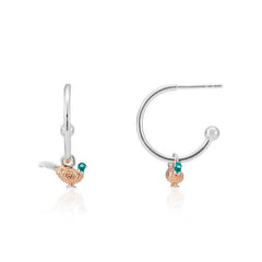 A pair of silver hoop earrings with a pheasant design, featuring rose gold details and green gemstones, displayed against a white background.
