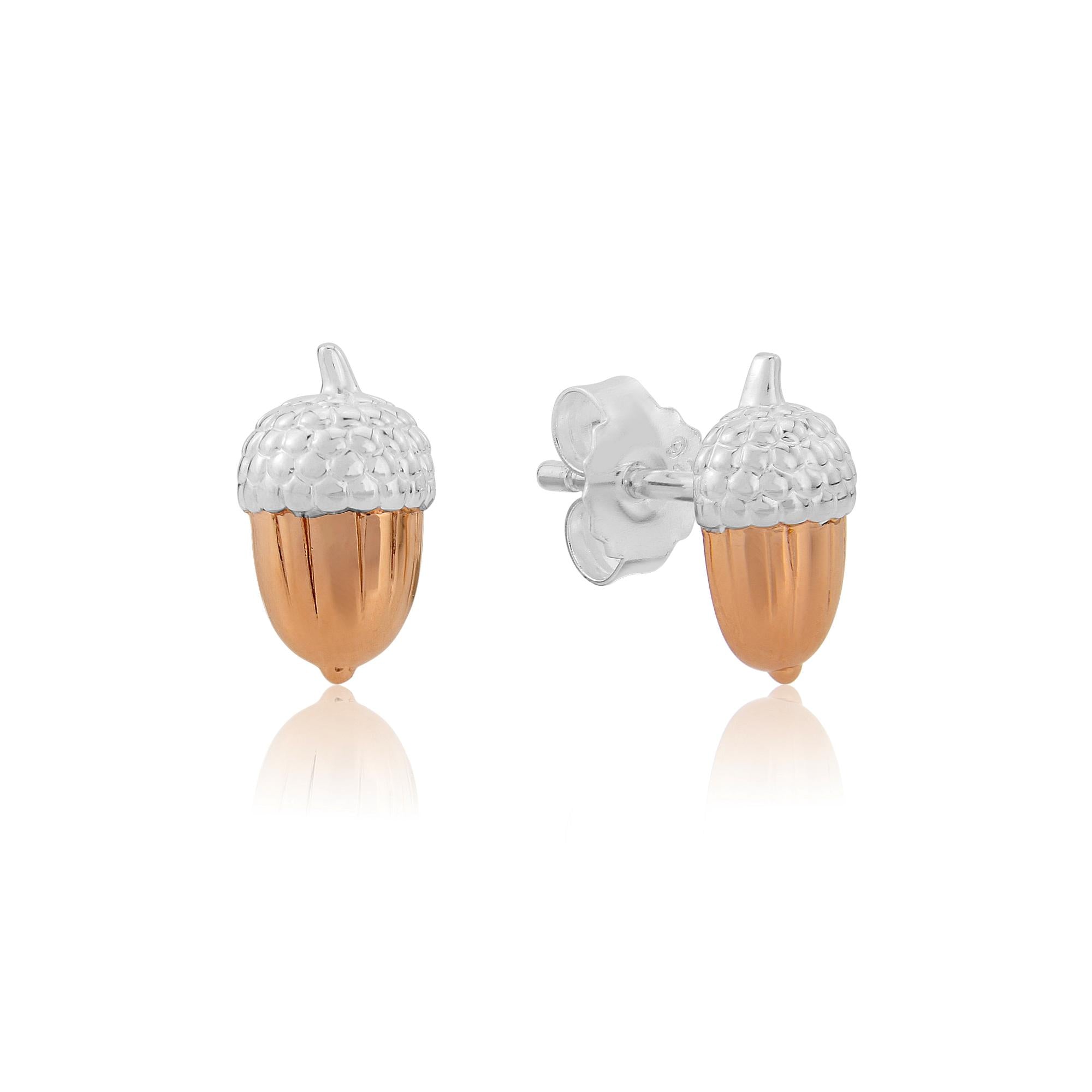 A pair of sterling silver acorn stud earrings with rose gold accents, displayed against a white background.