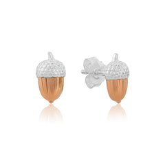 A pair of sterling silver acorn stud earrings with rose gold accents, displayed against a white background.