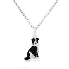 A sterling silver pendant in the shape of a black and white collie dog with a silver chain.