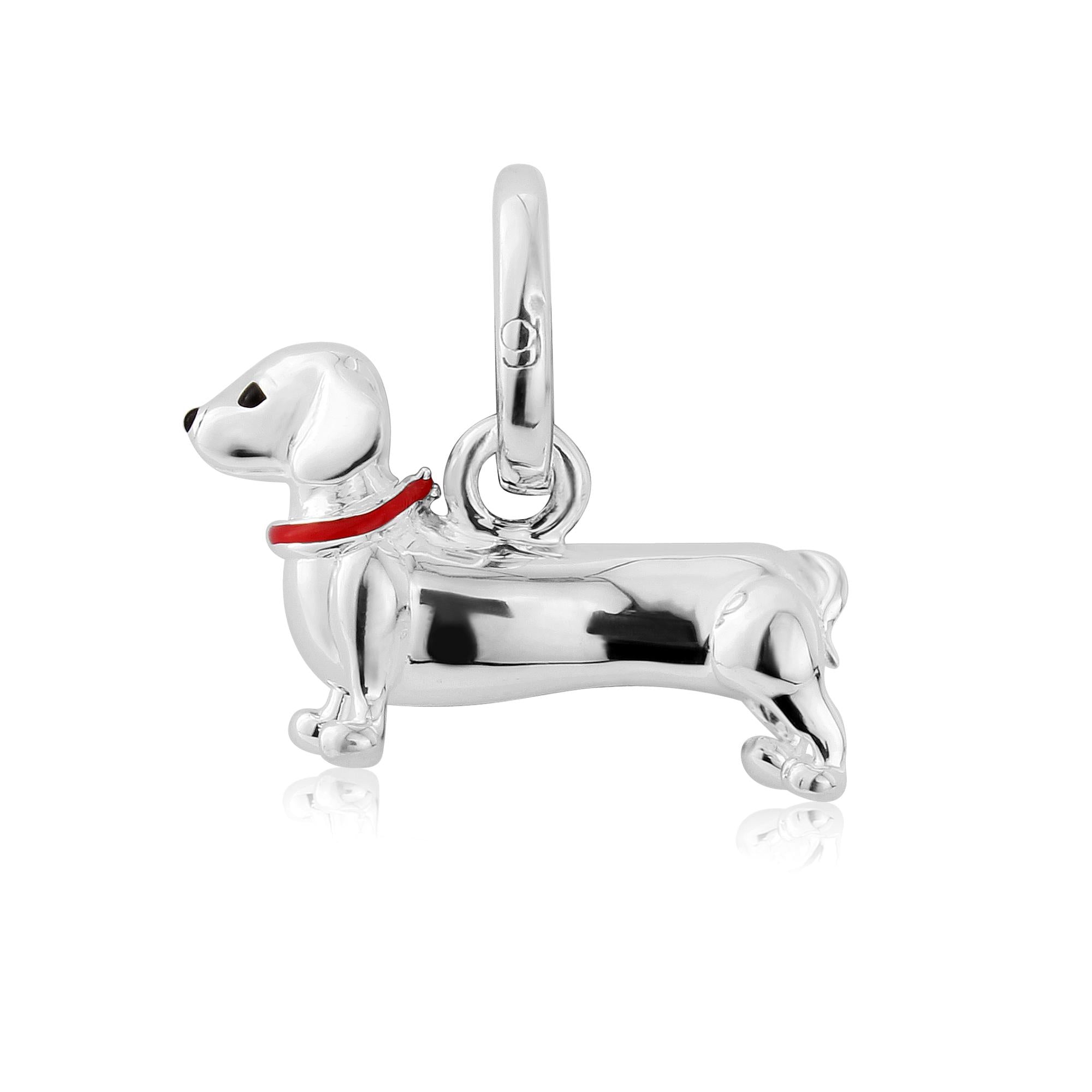 A sterling silver Dachshund dog charm with a red collar on a white background.