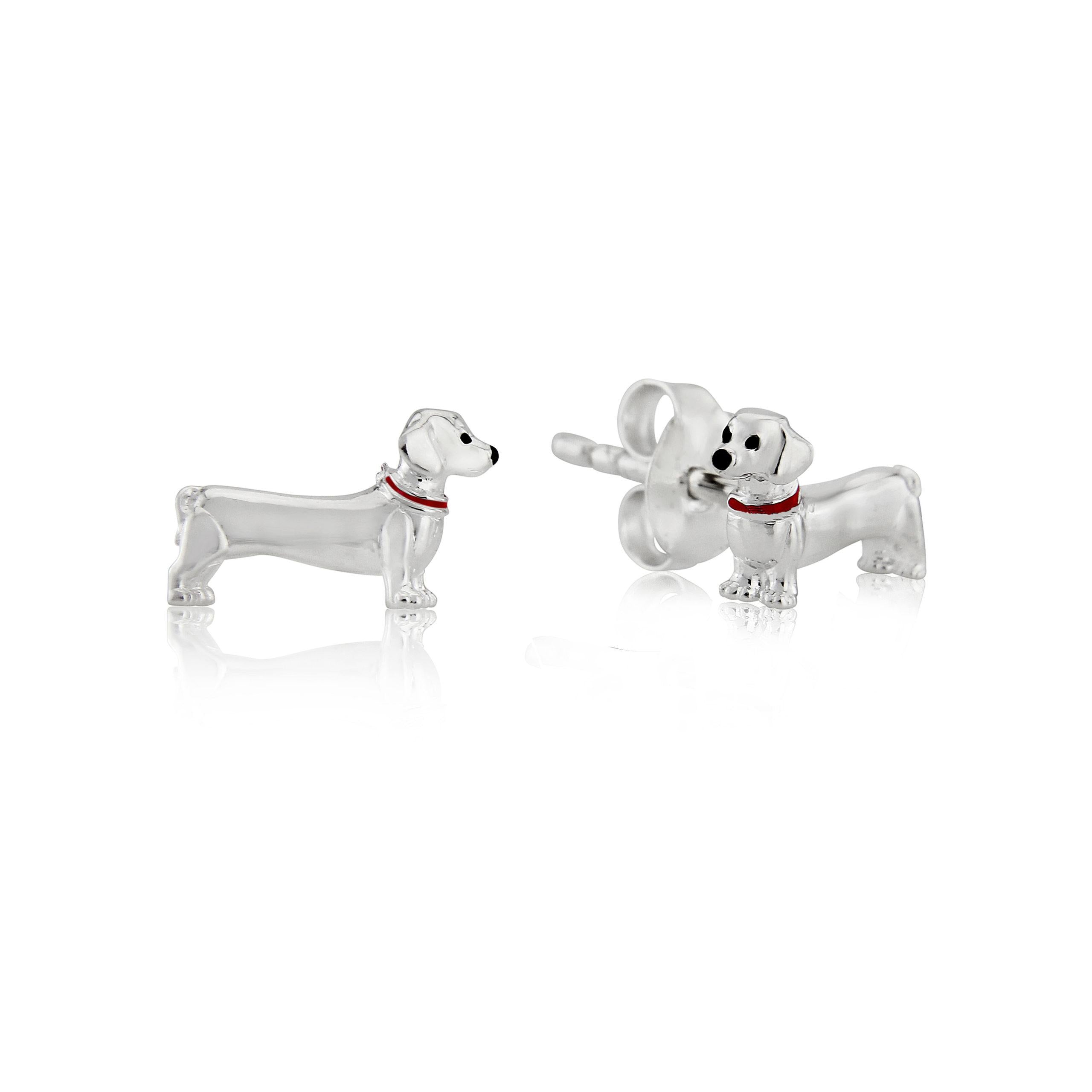 A pair of silver stud earrings shaped like Dachshunds with red enamel collars.