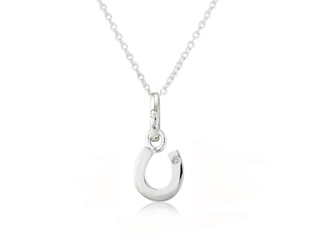 A sterling silver horseshoe pendant with a round diamond in the center, attached to a silver chain.