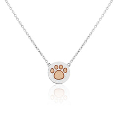 A sterling silver pendant with a rose gold paw print design on a disc, attached to a chain.