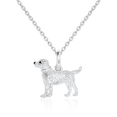 Silver dog pendant on a chain against a white background