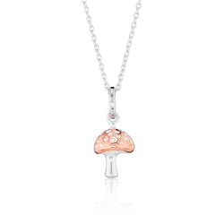 A sterling silver pendant in the shape of a mushroom with a rose gold vermeil top, attached to a silver chain.