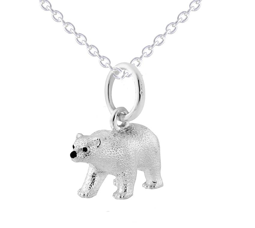 A sterling silver pendant in the shape of a polar bear, displayed on a silver chain against a white background.