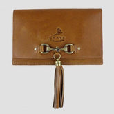 A brown leather clutch bag with a metallic clasp, tassel detailing, and the brand 'Grays' embossed on the front.