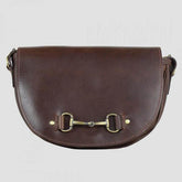 A brown natural leather shoulder bag with a snaffle bit detail on the strap and a magnetic front catch.