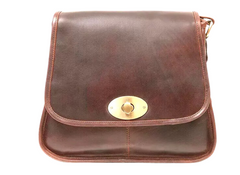 Brown leather bag with a gold clasp on a white background