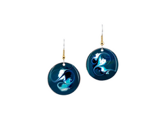 Blue circular earrings with intricate designs on a white background