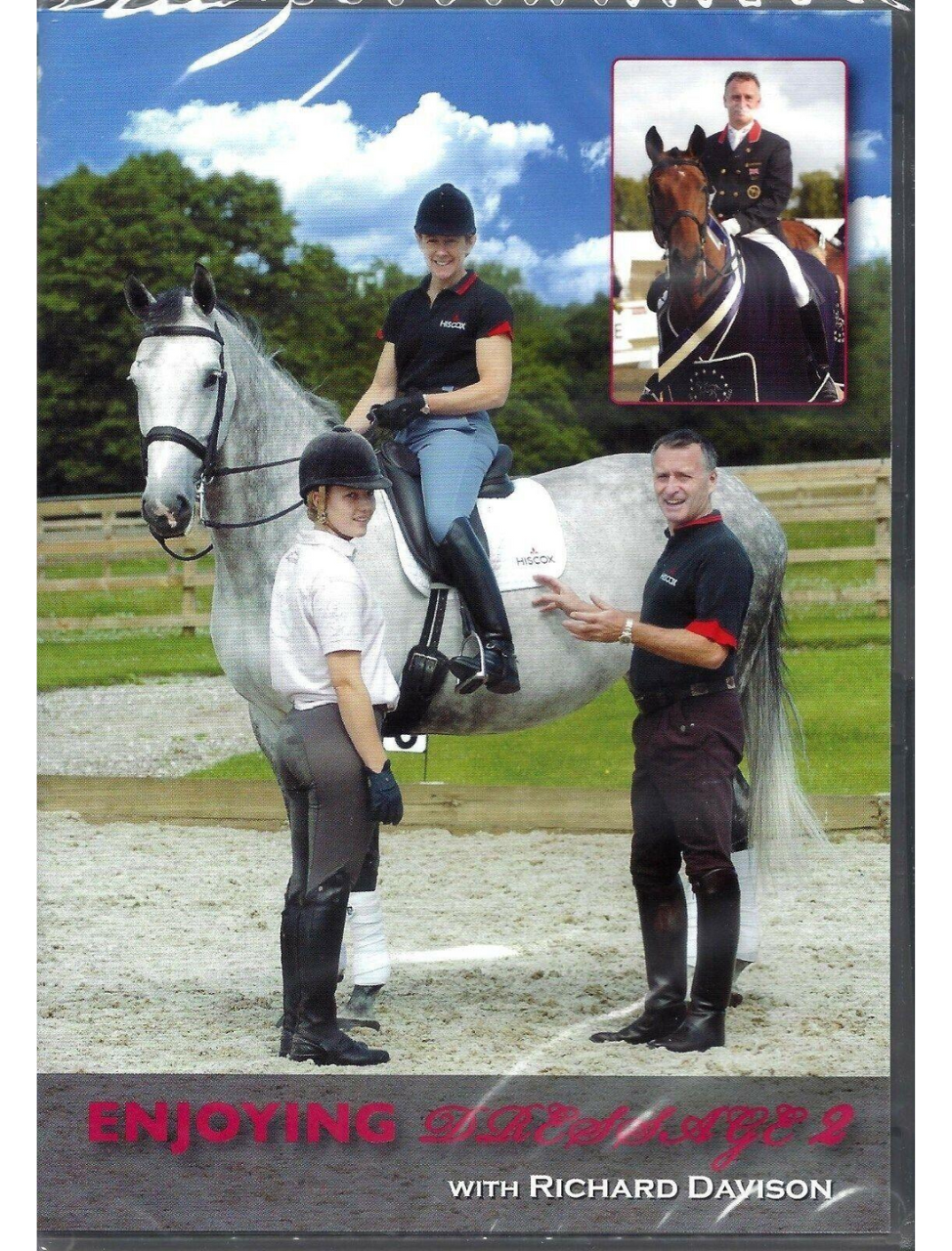 Cover of 'ENJOYING DRESSAGE VOL 2' featuring a person on horseback with a trainer standing beside the horse. The horse is white and the trainer is wearing a black shirt and pants.