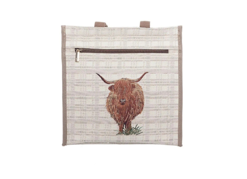 Handbag with a highland cow design on a white background