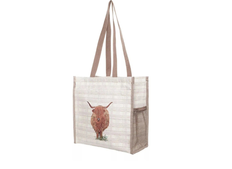 Tote bag with a highland cow design on a white background