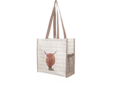 Tote bag with a highland cow design on a white background