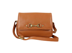Tan leather crossbody bag with gold hardware on a white background