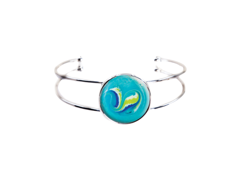 Silver bracelet with a blue circular charm featuring a colorful design on a white background