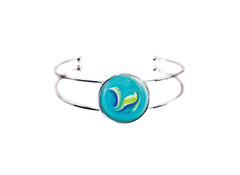 Silver bracelet with a blue circular charm featuring a colorful design on a white background