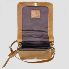 Side bag in natural leather from above with flap open showing compartments inside