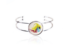 Silver bracelet with a round charm featuring a colorful fish design on a white background