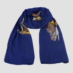A blue chiffon scarf with a pheasant artwork design spread out on a plain surface.
