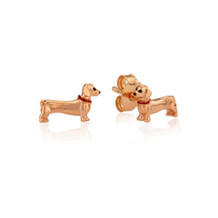 Rose gold stud earrings in the shape of Dachshunds with a red enamel collar.