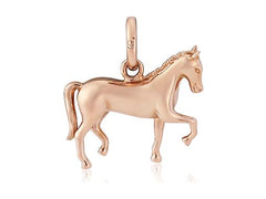 A rose gold charm in the shape of a dressage horse in motion.