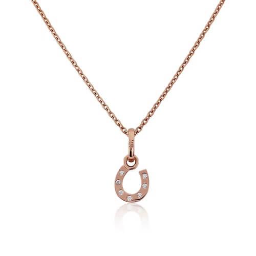 A rose gold vermeil horseshoe pendant necklace with cubic zirconia stones, displayed on a white background.