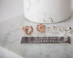 Set of earrings on a 'GALLOP COLLECTION' card with a marble background