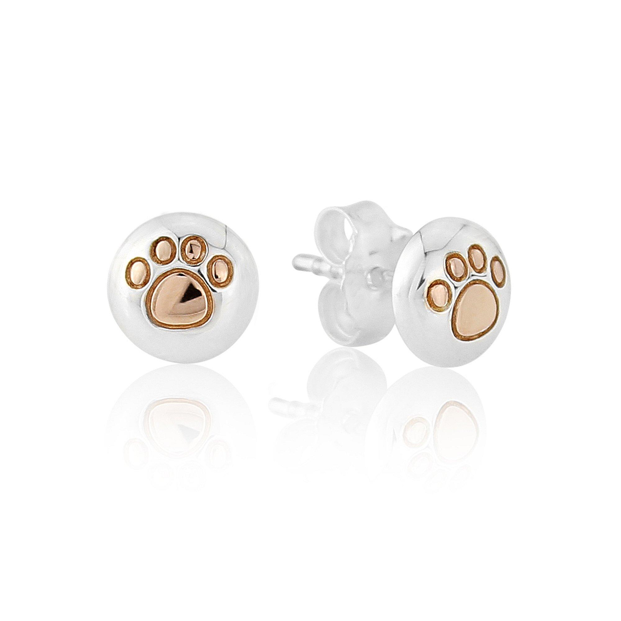 A pair of rose gold and silver stud earrings with a paw print design on a white background.