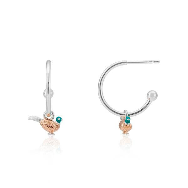 A pair of silver hoop earrings with a pheasant design, featuring rose gold details and green gemstones, displayed against a white background.