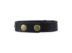 Black leather bracelet with two gold studs on a white background