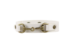 White leather bracelet with brass horse bit clasp on a white background