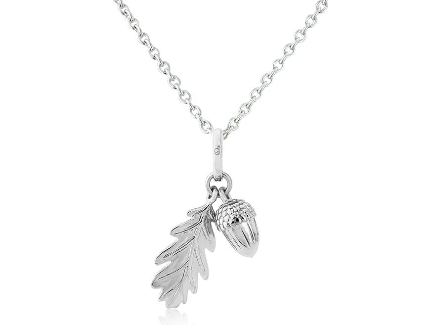 A sterling silver pendant featuring an acorn and leaf design, attached to a chain.