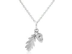 A sterling silver pendant featuring an acorn and leaf design, attached to a chain.