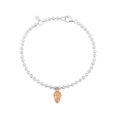 A sterling silver bracelet with rose gold beaded details and an acorn charm, adjustable in length.
