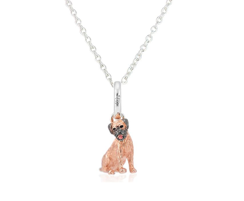 Sterling silver pendant in the shape of a Border Terrier with rose gold vermeil detailing and an enamel pink tongue, accompanied by a silver chain.