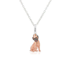 Sterling silver pendant in the shape of a Border Terrier with rose gold vermeil detailing and an enamel pink tongue, accompanied by a silver chain.