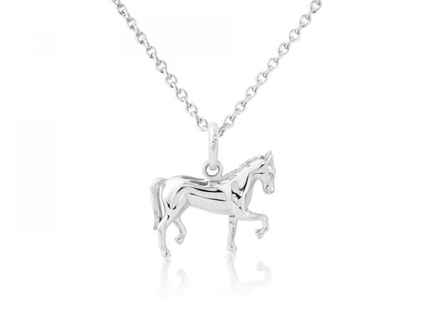 A sterling silver pendant in the shape of a dressage horse in motion, accompanied by an adjustable sterling silver chain.