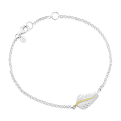 A sterling silver bracelet with a delicate feather charm and a yellow gold vermeil center stem, displayed on a white background.