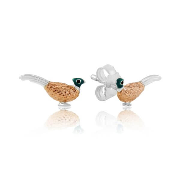 A pair of sterling silver pheasant stud earrings with rose gold vermeil and enamel details, presented in a velvet pouch.