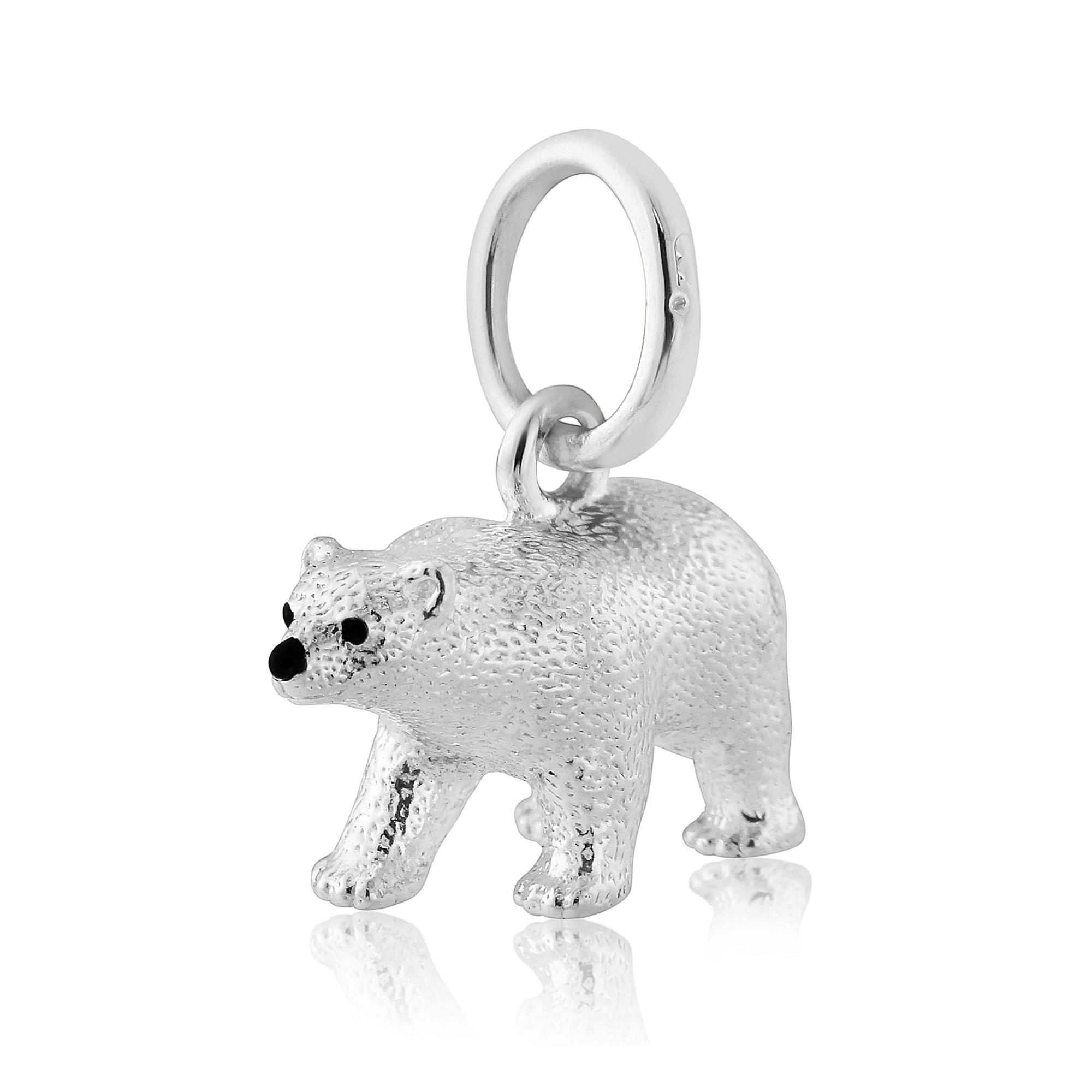 A sterling silver charm shaped like a polar bear with a loop for a necklace chain.