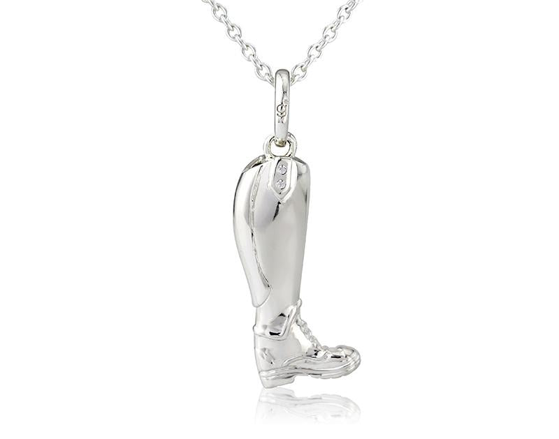 A sterling silver riding boot pendant with cubic zirconia stones, displayed on an adjustable silver chain.